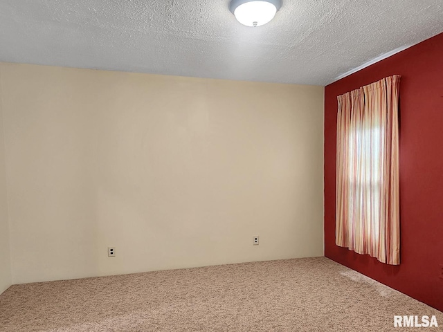 419 S Franklin St, Toulon, IL 61483 - empty room with carpet flooring and a textured ceiling