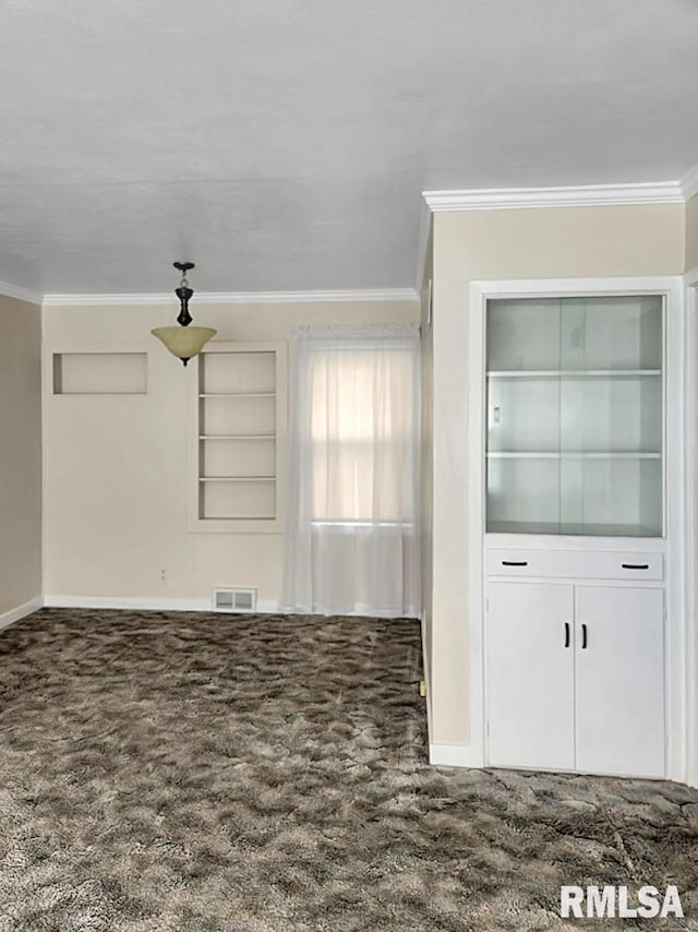 419 S Franklin St, Toulon, IL 61483 - carpeted empty room with crown molding, baseboards, and built in shelves