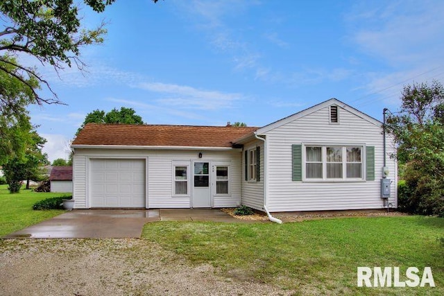 419 S Franklin St, Toulon, IL 61483 - view of front of home with driveway, a garage, and a front lawn