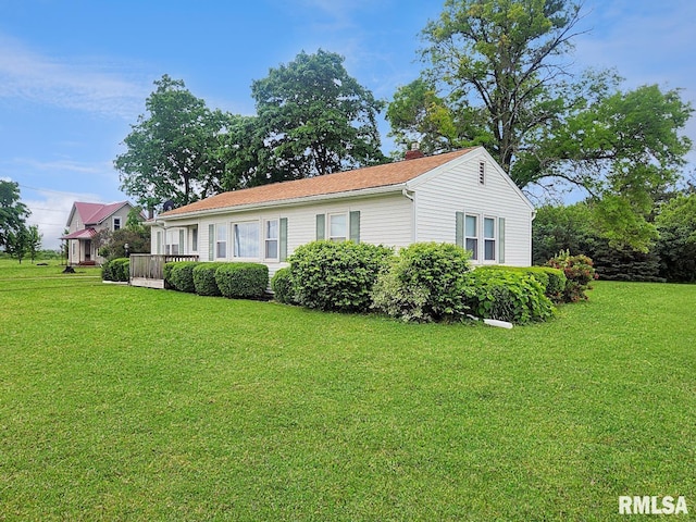 419 S Franklin St, Toulon, IL 61483 - view of front of home featuring a chimney and a front lawn