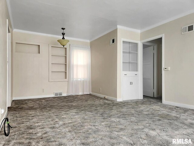 419 S Franklin St, Toulon, IL 61483 - unfurnished living room with ornamental molding, baseboards, and carpet flooring