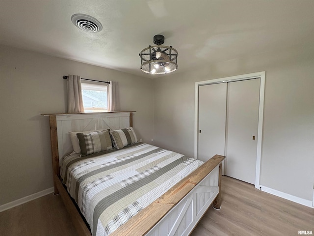 606 Lasalle Blvd, Marquette Heights, IL 61554 - bedroom featuring light wood-type flooring, baseboards, and a closet