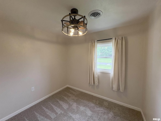 606 Lasalle Blvd, Marquette Heights, IL 61554 - empty room with carpet flooring, baseboards, and a chandelier