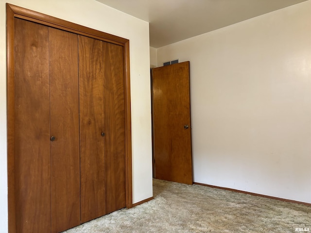 6 Bay Shore Dr, Lacon, IL 61540 - unfurnished bedroom with carpet, a closet, and baseboards