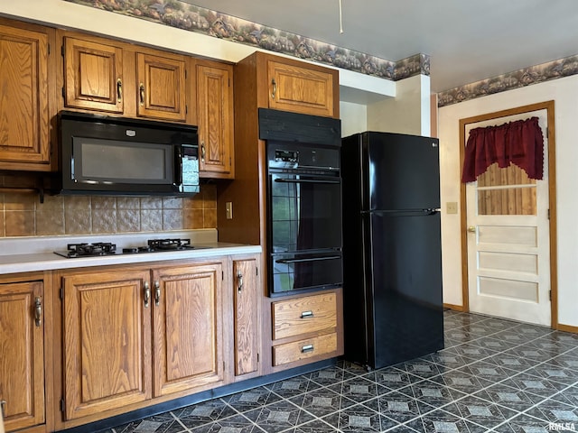 6 Bay Shore Dr, Lacon, IL 61540 - kitchen with black appliances, a warming drawer, brown cabinetry, and tasteful backsplash