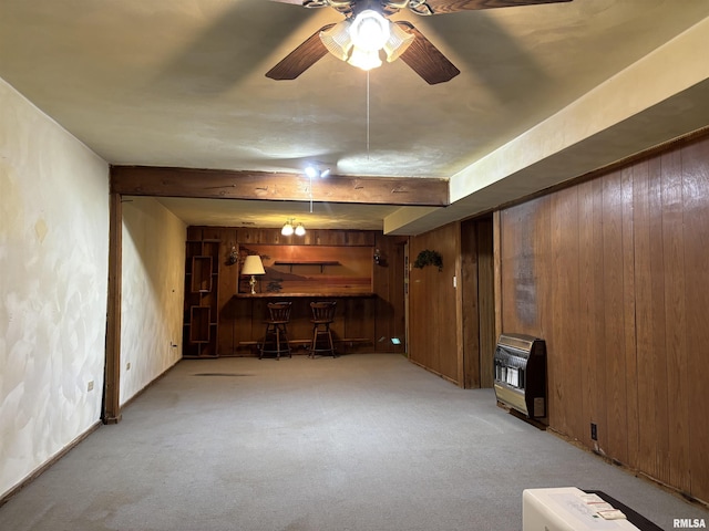 6 Bay Shore Dr, Lacon, IL 61540 - unfurnished living room with heating unit, bar, wood walls, light carpet, and ceiling fan