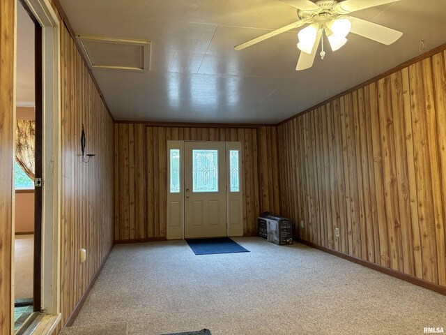 6 Bay Shore Dr, Lacon, IL 61540 - unfurnished room featuring carpet, wood walls, a ceiling fan, and baseboards