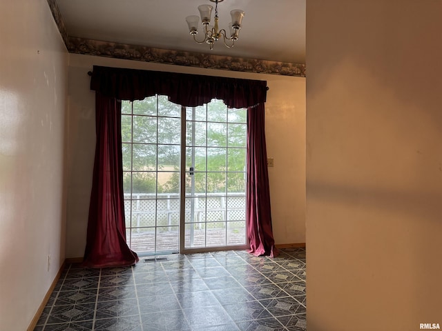 6 Bay Shore Dr, Lacon, IL 61540 - empty room with baseboards and a chandelier