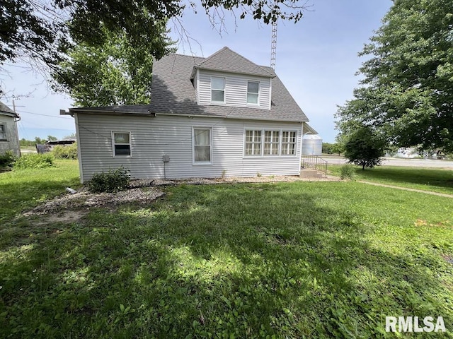 102 W 1st St, Table Grove, IL 61482 - rear view of property with a yard and a shingled roof
