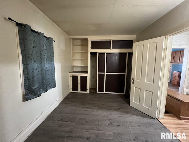 102 W 1st St, Table Grove, IL 61482 - unfurnished bedroom with wood finished floors and baseboards