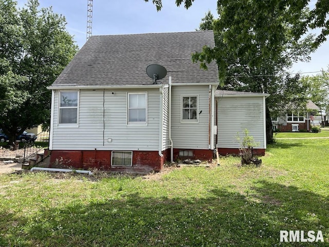 102 W 1st St, Table Grove, IL 61482 - back of house with a lawn and a shingled roof