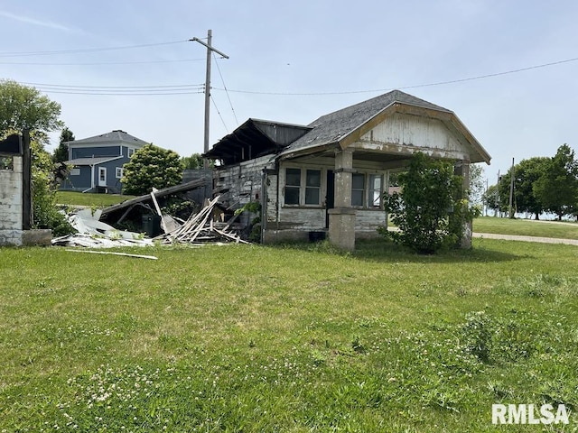 102 W 1st St, Table Grove, IL 61482 - view of side of property featuring a lawn