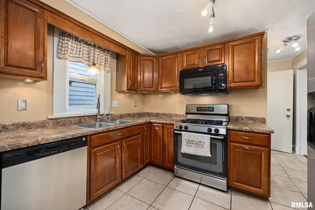 1614 W Columbia Ter, Peoria, IL 61606 - kitchen with stainless steel appliances, a sink, light tile patterned flooring, dark countertops, and brown cabinets