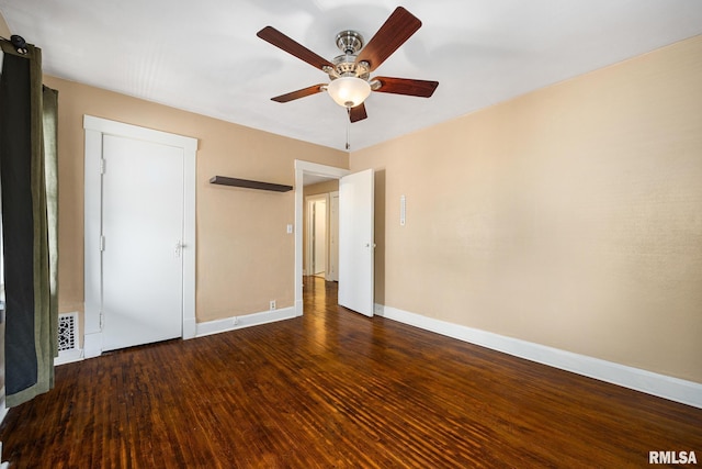 1614 W Columbia Ter, Peoria, IL 61606 - unfurnished bedroom featuring baseboards, wood finished floors, and ceiling fan
