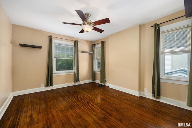 1614 W Columbia Ter, Peoria, IL 61606 - spare room with wood finished floors, healthy amount of natural light, and baseboards