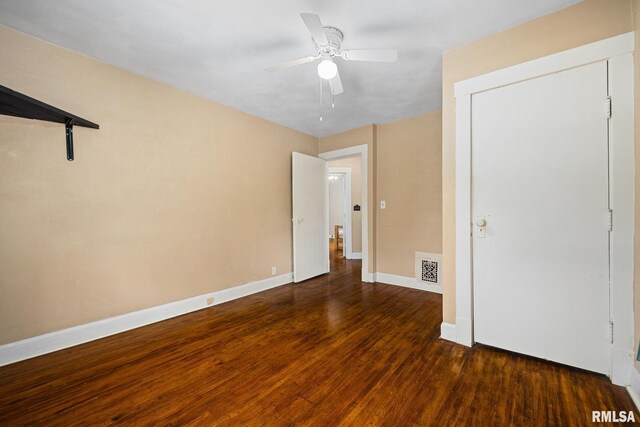 1614 W Columbia Ter, Peoria, IL 61606 - unfurnished bedroom with wood finished floors, baseboards, and ceiling fan