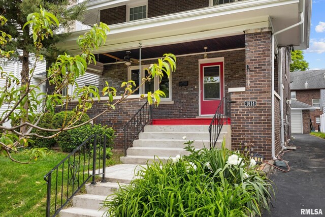 1614 W Columbia Ter, Peoria, IL 61606 - doorway to property with brick siding, a porch, and ceiling fan