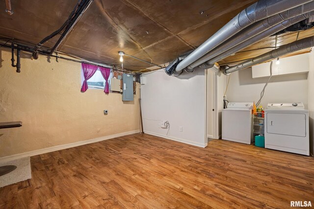 1614 W Columbia Ter, Peoria, IL 61606 - below grade area featuring separate washer and dryer, electric panel, wood finished floors, and baseboards