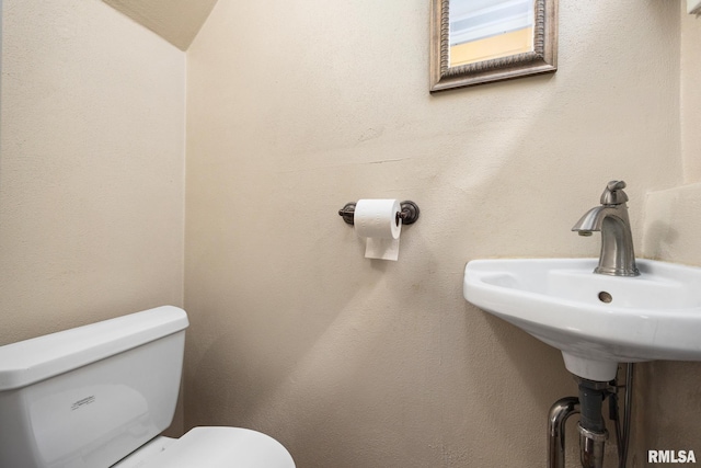 1614 W Columbia Ter, Peoria, IL 61606 - bathroom featuring toilet and a sink