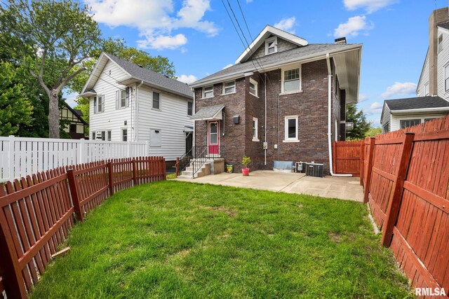 1614 W Columbia Ter, Peoria, IL 61606 - rear view of house with brick siding, central AC, and a patio area