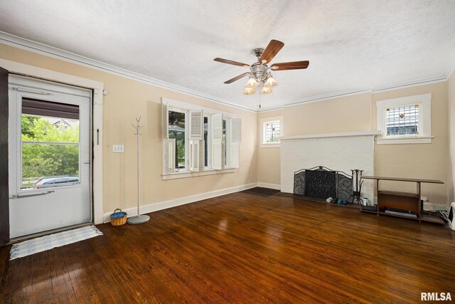 1614 W Columbia Ter, Peoria, IL 61606 - unfurnished living room featuring wood finished floors, ornamental molding, a fireplace, ceiling fan, and baseboards