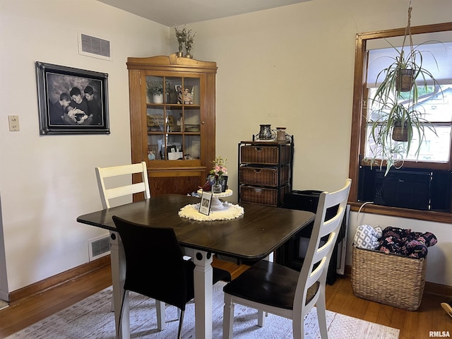 313 N Edwards St, Macomb, IL 61455 - dining space with wood finished floors and baseboards