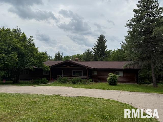1 Marty Ln, Macomb, IL 61455 - log-style house featuring a front lawn and driveway