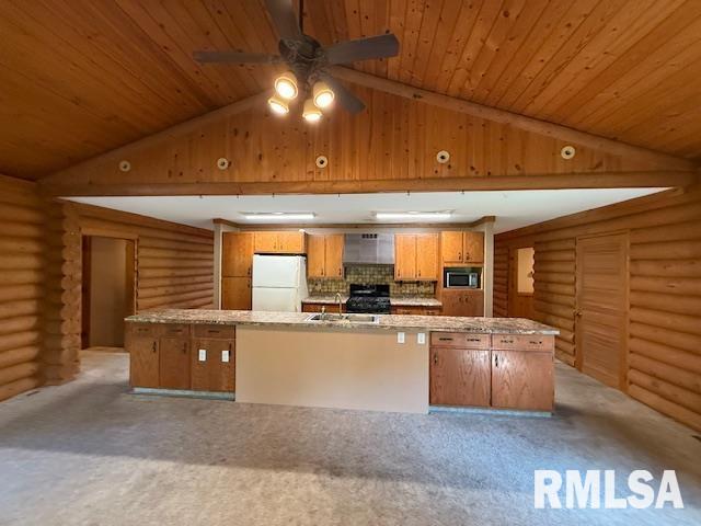 1 Marty Ln, Macomb, IL 61455 - unfurnished room with rustic walls, vaulted ceiling, a ceiling fan, carpet floors, and a textured ceiling
