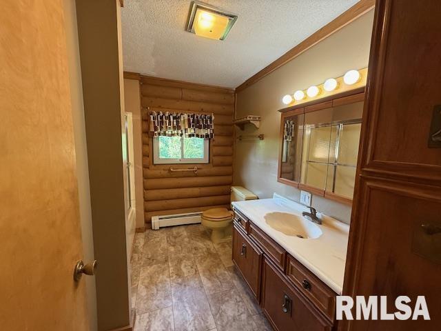 1 Marty Ln, Macomb, IL 61455 - carpeted spare room with a textured ceiling, a baseboard radiator, rustic walls, and healthy amount of natural light