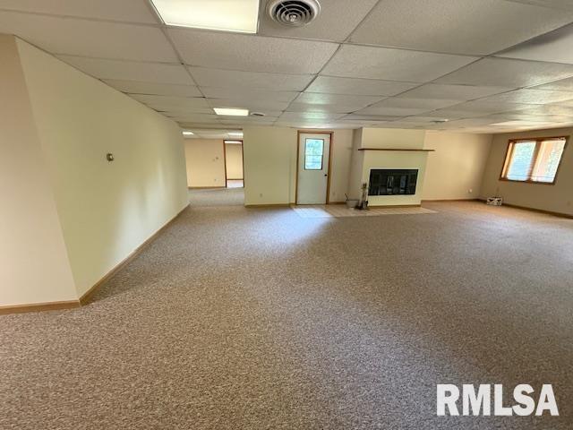 1 Marty Ln, Macomb, IL 61455 - carpeted spare room featuring a paneled ceiling, baseboard heating, and baseboards