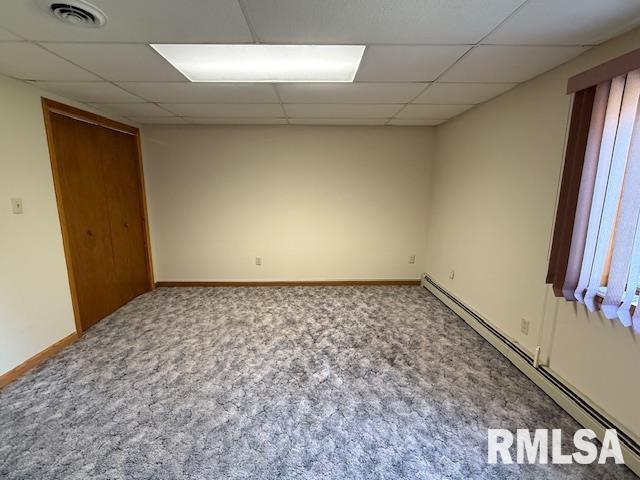 1 Marty Ln, Macomb, IL 61455 - bathroom with toilet, a shower, vanity, baseboards, and tile patterned floors