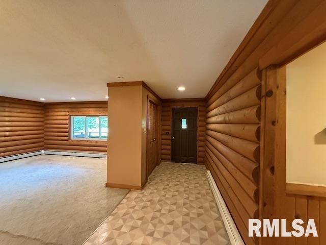 1 Marty Ln, Macomb, IL 61455 - entryway with rustic walls, recessed lighting, light colored carpet, baseboards, and a baseboard radiator
