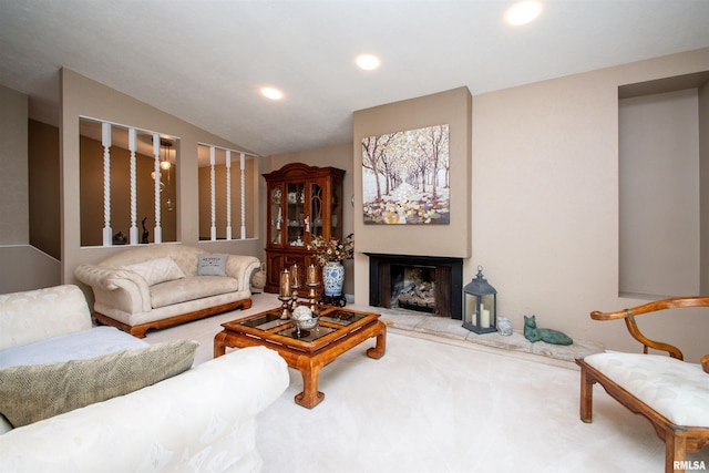 32 Black Partridge Run, Hopewell, IL 61565 - carpeted living room with a fireplace with raised hearth, recessed lighting, and lofted ceiling