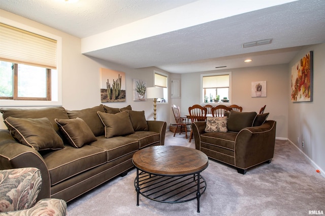 32 Black Partridge Run, Hopewell, IL 61565 - carpeted living area featuring a textured ceiling