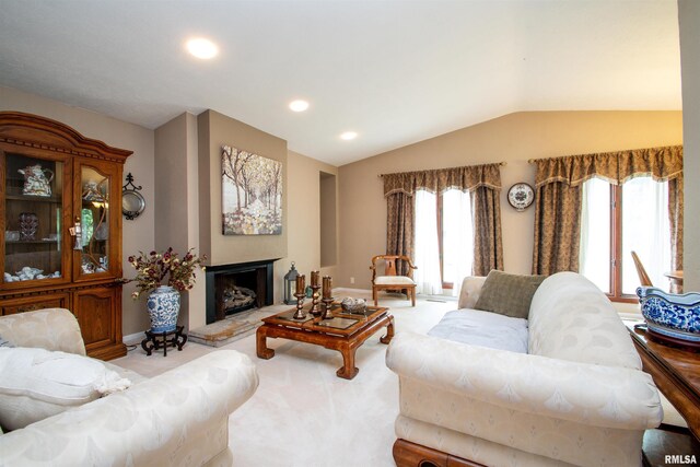 32 Black Partridge Run, Hopewell, IL 61565 - living room with lofted ceiling, light colored carpet, recessed lighting, and a fireplace with raised hearth