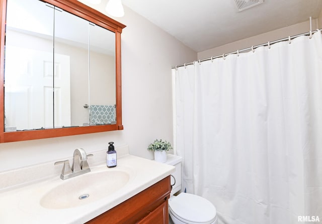 311 Juniper Ln, East Peoria, IL 61611 - full bath featuring vanity, toilet, and a shower with shower curtain