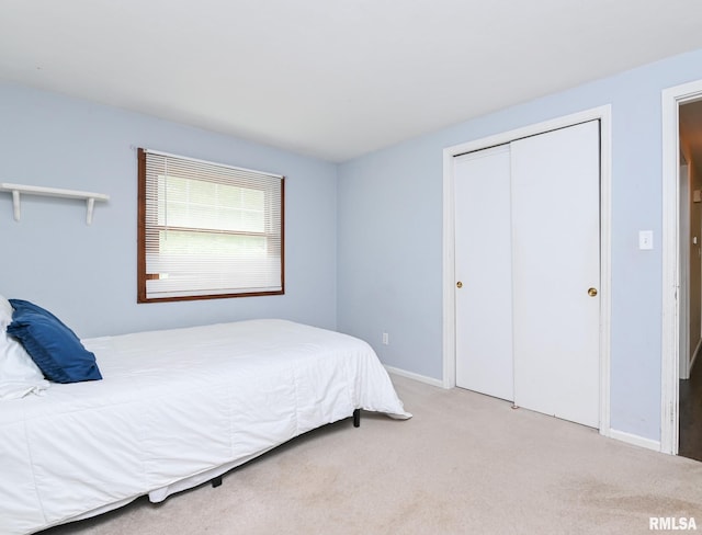311 Juniper Ln, East Peoria, IL 61611 - bedroom with a closet, carpet flooring, and baseboards