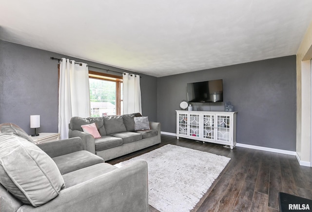 311 Juniper Ln, East Peoria, IL 61611 - living room featuring dark wood-style floors and baseboards