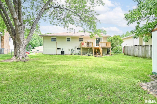 311 Juniper Ln, East Peoria, IL 61611 - back of property featuring a wooden deck, stairway, and a chimney