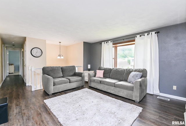311 Juniper Ln, East Peoria, IL 61611 - living area with dark wood-style floors and baseboards