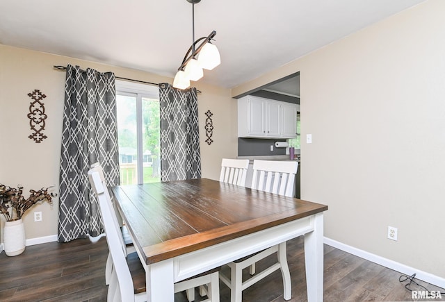 311 Juniper Ln, East Peoria, IL 61611 - dining area featuring dark wood-style floors and baseboards