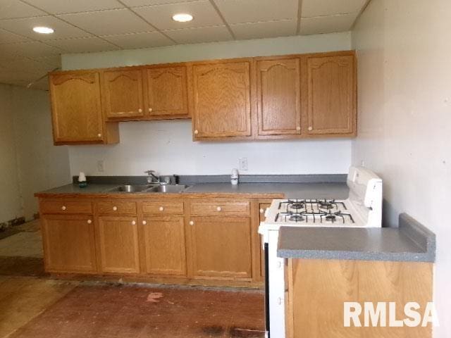 837 E Chestnut St, Canton, IL 61520 - kitchen featuring a sink, white gas range oven, and recessed lighting