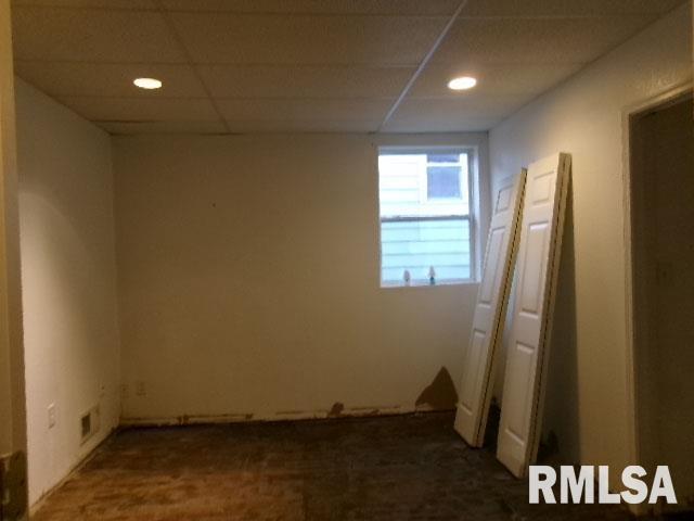 837 E Chestnut St, Canton, IL 61520 - unfurnished room featuring a paneled ceiling and recessed lighting