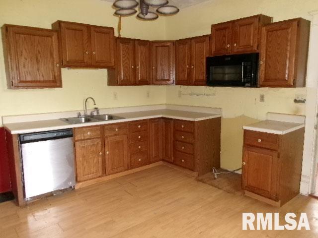 896 E Chestnut St, Canton, IL 61520 - kitchen featuring black microwave, dishwasher, a sink, light wood-type flooring, and brown cabinets