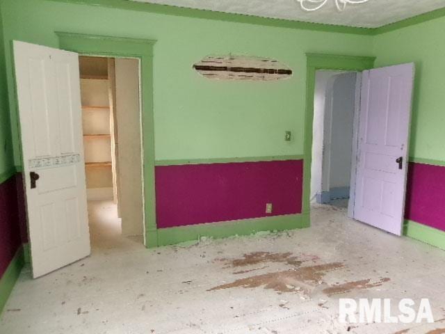 896 E Chestnut St, Canton, IL 61520 - unfurnished room featuring baseboards
