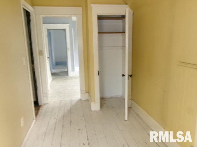 896 E Chestnut St, Canton, IL 61520 - hallway with wood finished floors