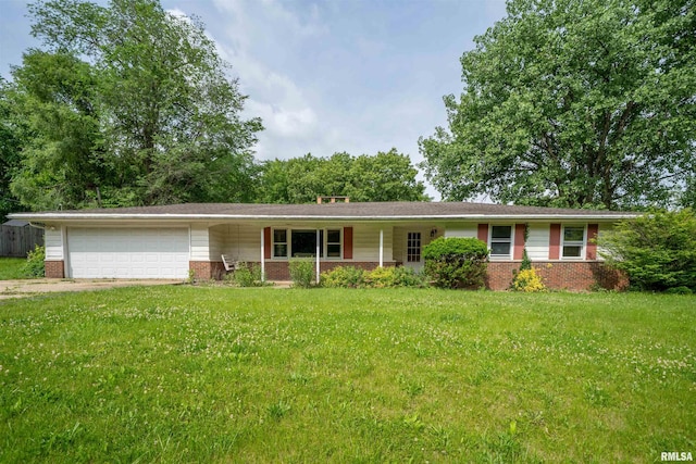 23907 Veterans Rd, Morton, IL 61550 - ranch-style home with brick siding, a garage, a front lawn, and concrete driveway