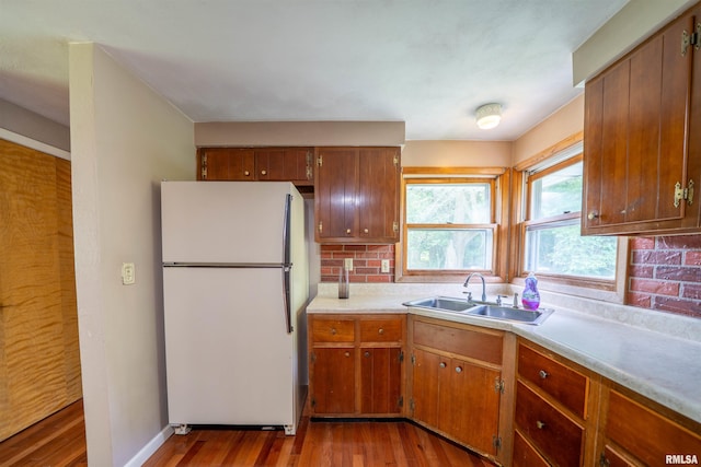 23907 Veterans Rd, Morton, IL 61550 - kitchen featuring freestanding refrigerator, a sink, wood finished floors, and light countertops