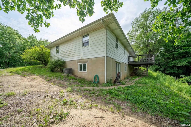 23907 Veterans Rd, Morton, IL 61550 - view of side of home with central AC unit and a wooden deck