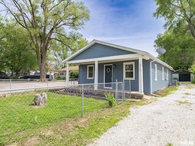 5720 W Farmington Rd, Peoria, IL 61604 - view of front of house featuring covered porch and gravel driveway